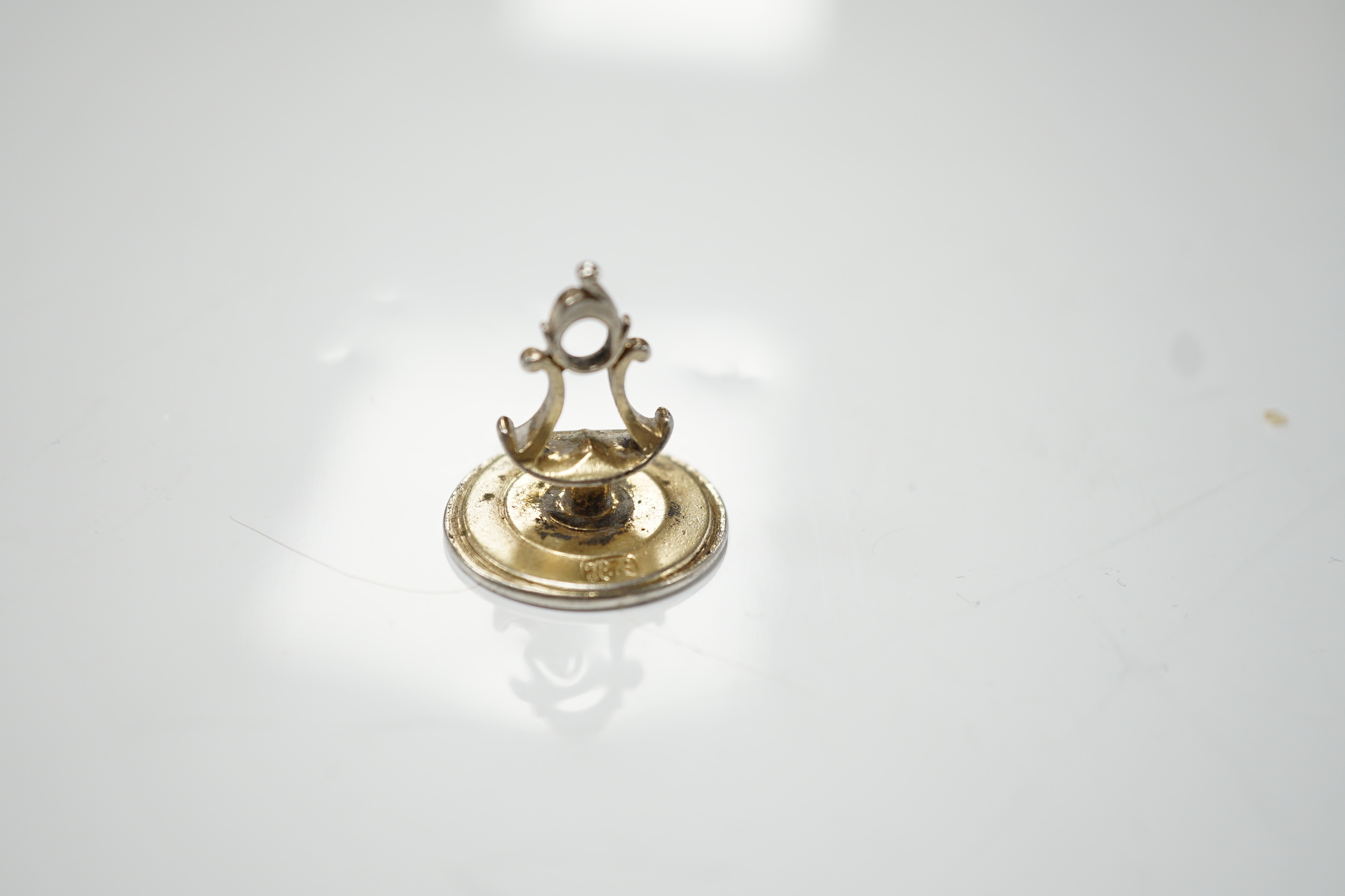 A George III parcel gilt silver fob seal, by Hester Bateman, London, circa 1770, 23mm, the matrix with crested monogram.